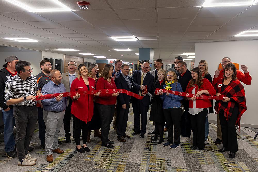 Beloit College staff and guests cut the ribbon